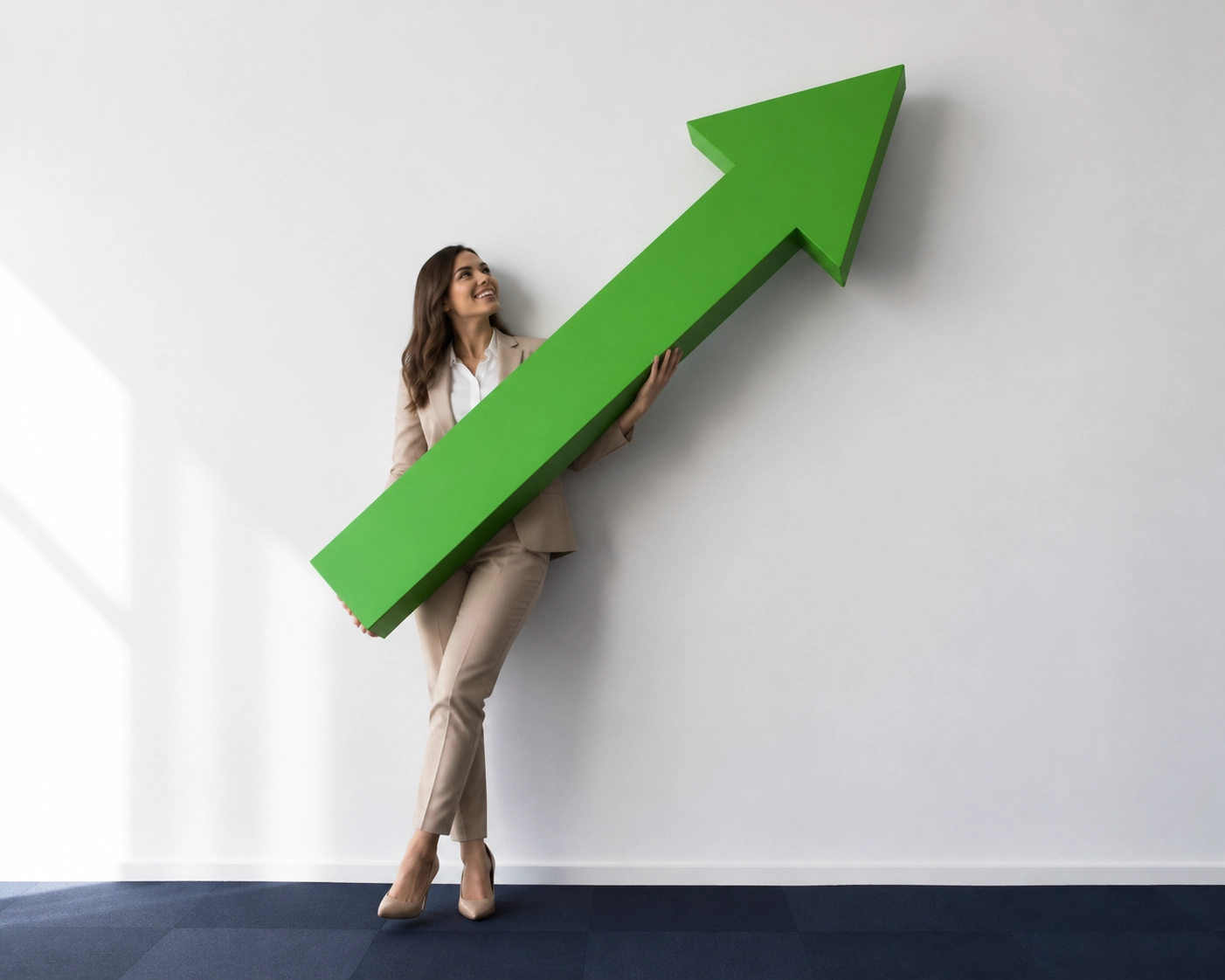 Woman effortlessly lifting a large green arrow to show growth from professional franchise sales outsourcing.
