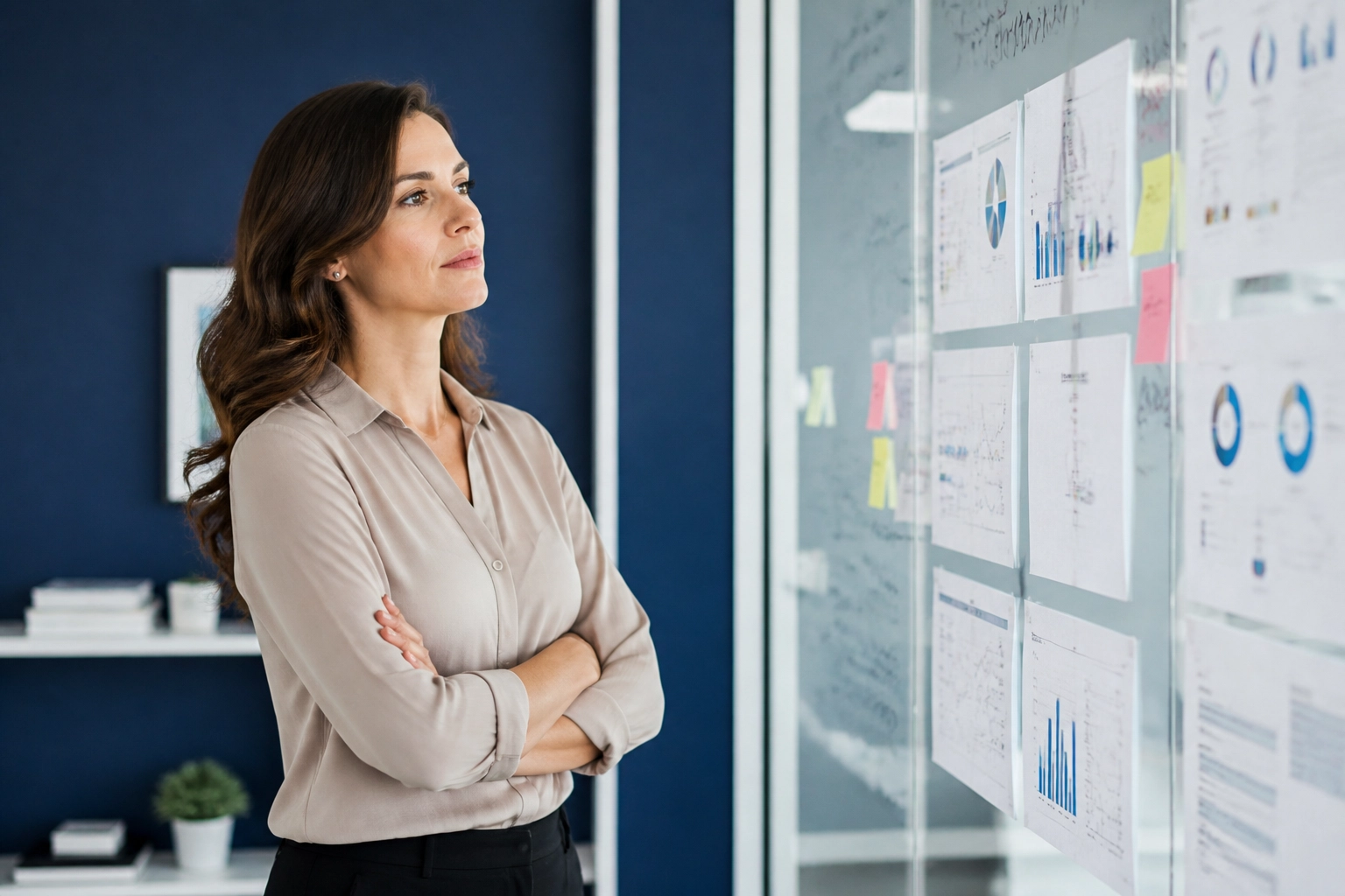 Female executive analyzing a data-backed roadmap for franchise development services in a modern office.