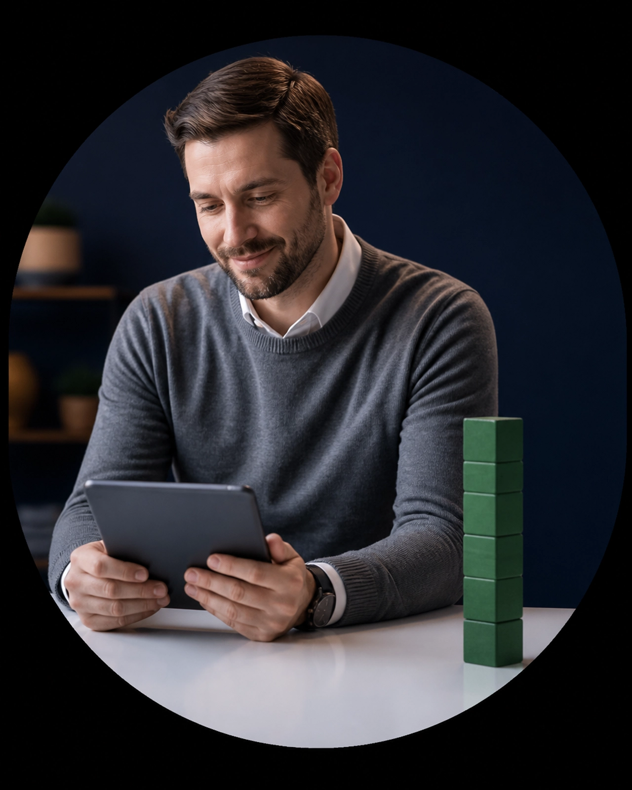 A professional at a desk looking at a tablet, representing structured growth.